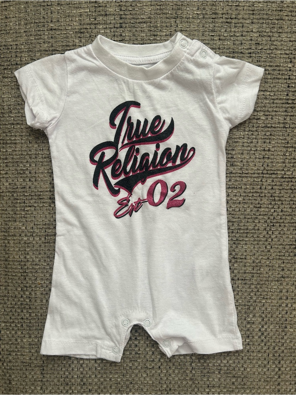 True Religion White Baby One-Piece Romper with Pink & Black Logo